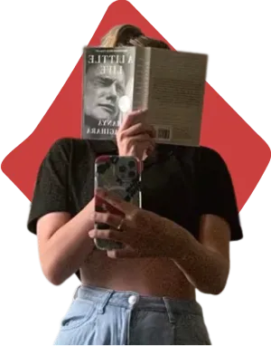 A woman holding a book in one hand and a cell phone in the other, looking engaged and thoughtful.